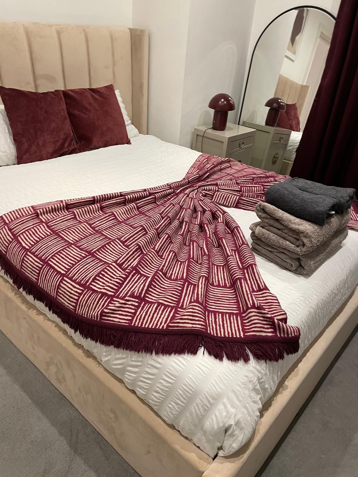 Bedroom with fresh linens and towels